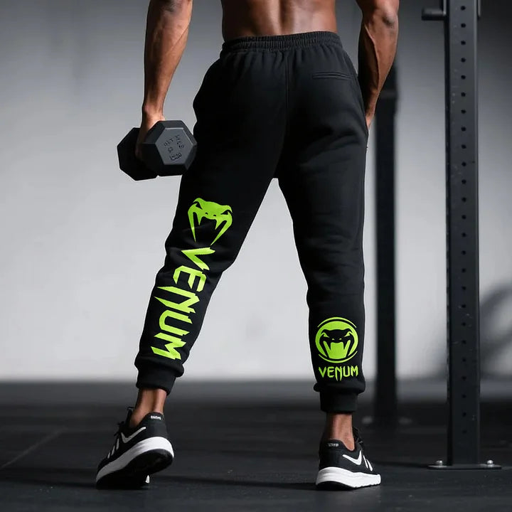 Spodnie OVERSIZED Venu Lime czarne z neonowym logo, model z hantlami. Idealne do sportu i fitnessu.